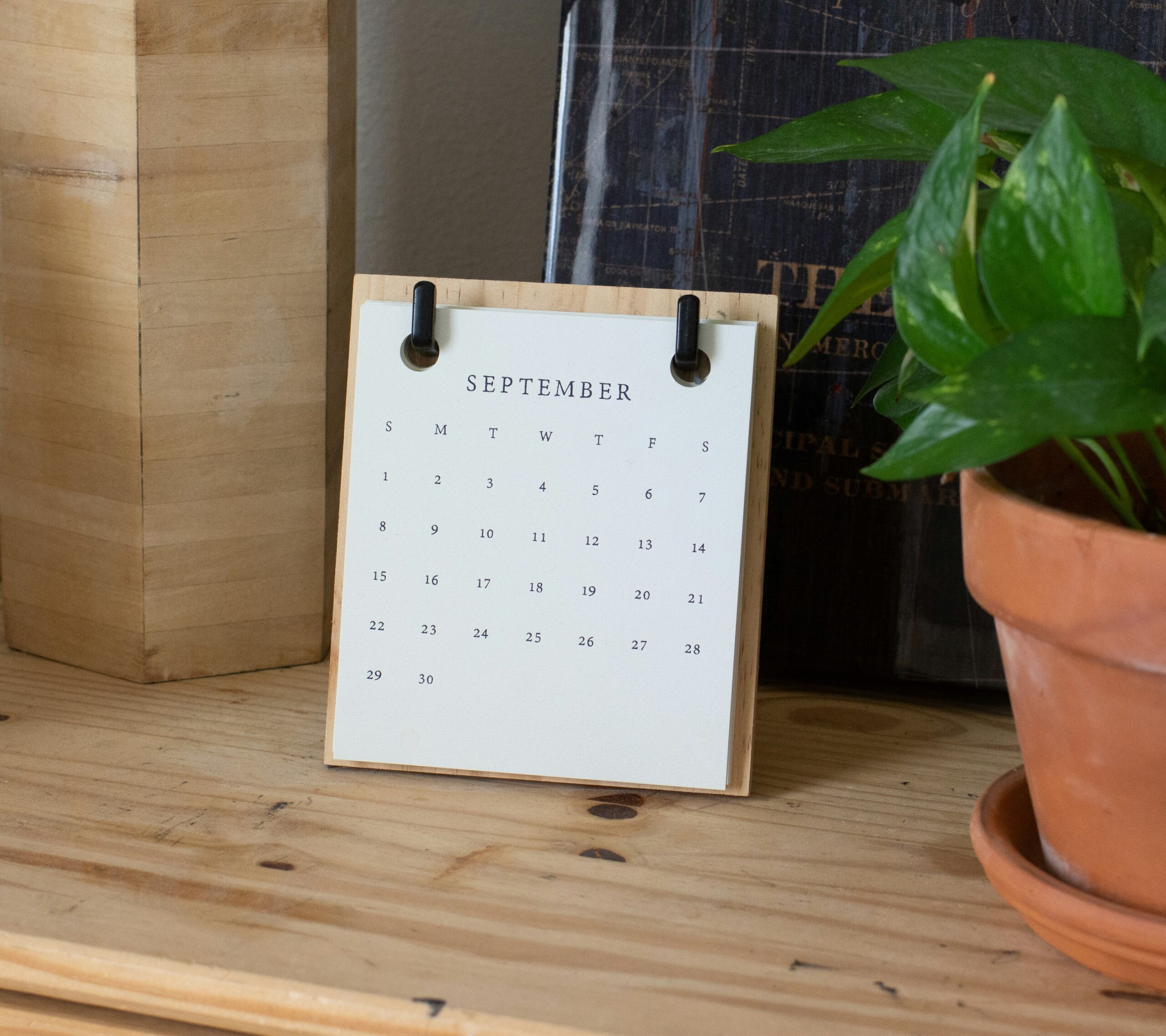 image of a september calendar on a shelf