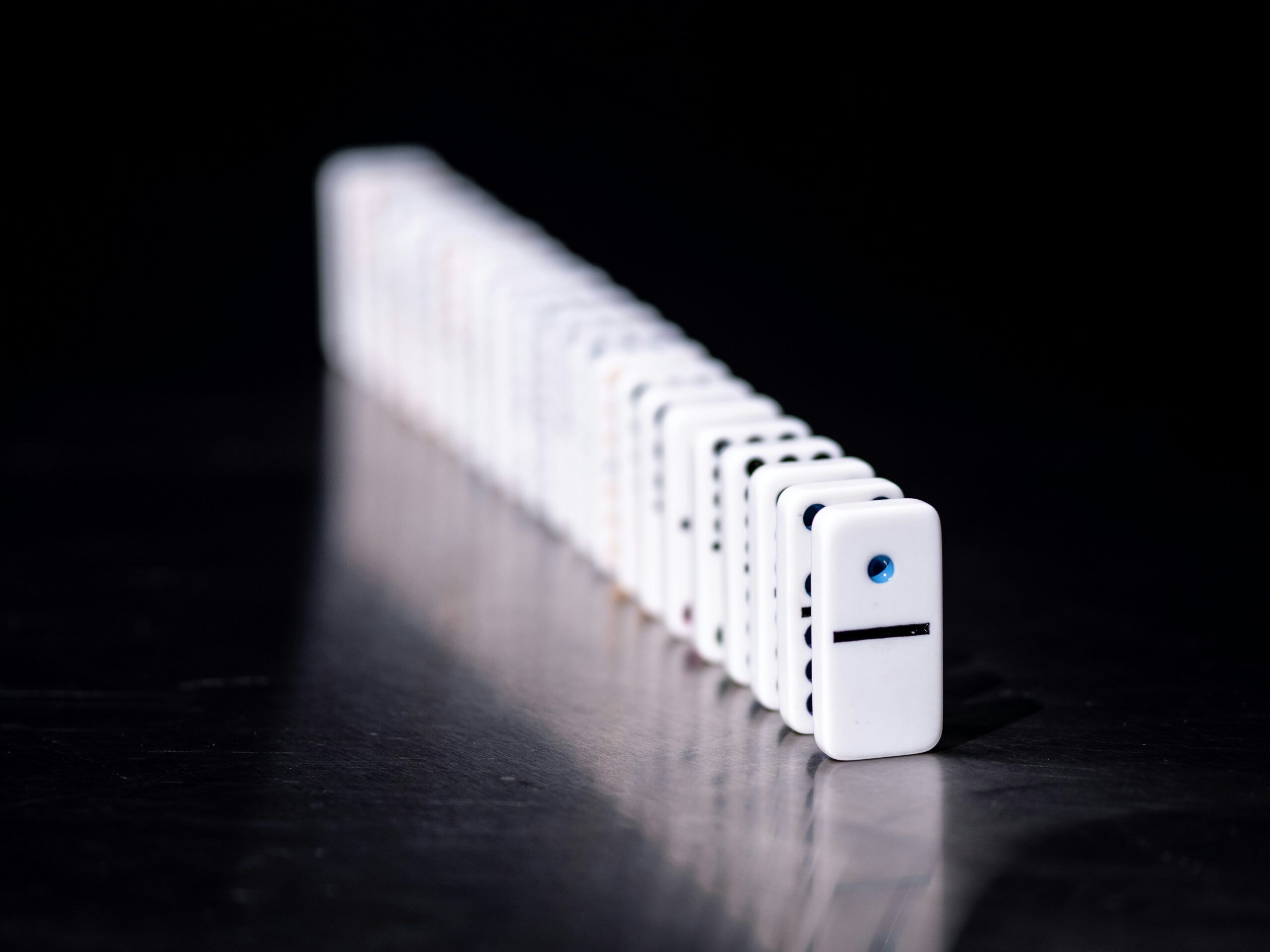 image of a row of dominos standing up